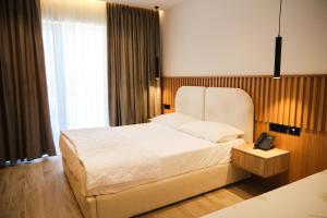 Postel nebo postele na pokoji v ubytování Albatros Beach & Resort