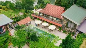 an overhead view of a house with a swimming pool at Villa Xiav - Flipside Adventures in Bản Kin