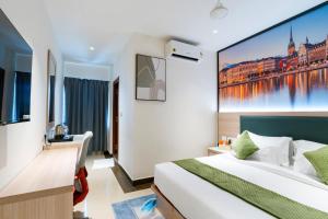 Postel nebo postele na pokoji v ubytování The Orange Hotel - Narsingi, Hyderabad