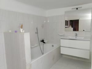 a white bathroom with a shower and a sink at Casa Vacanze da Melina in Taranto +45 photos