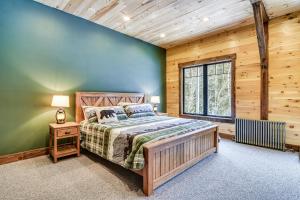 Un pat sau paturi într-o cameră la Maine Home with Hot Tub and Snowmobile Trail Access!