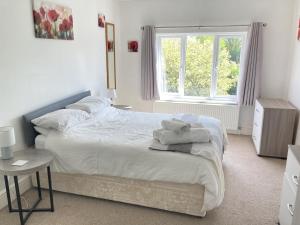 a bedroom with two beds and a window at Large 4 bed detached house with parking in Newark-on-Trent