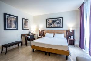 Postel nebo postele na pokoji v ubytování Stadio Hotel