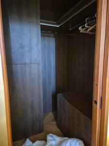 an open door to a room with a bed and a closet at LUXE-POLE Appartement à 100m de Monaco in Cap d'Ail