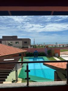 a view of a swimming pool from a building at Duplex à 800 mts do Beach Park COM 5 suítes in Aquiraz