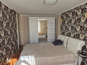 Postel nebo postele na pokoji v ubytování Mäe Apartment