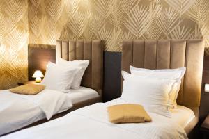 Ένα ή περισσότερα κρεβάτια σε δωμάτιο στο Hotel Neptun +100 φωτογραφίες