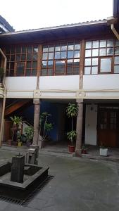 a building with a lot of windows and plants at DEPARTAMENTO SIETE in Quito +25 photos
