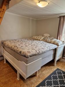 Postel nebo postele na pokoji v ubytování Madickenhuset