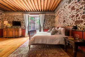 Postel nebo postele na pokoji v ubytování CASA SAUTO SUITE CON BALCON