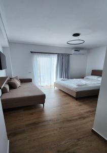 Voodi või voodid majutusasutuse Hotel LBC toas
