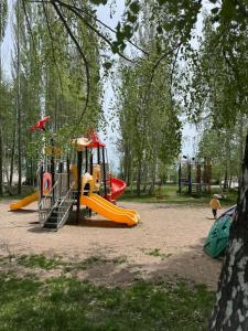 a playground with a slide in a park at A quiet harbor on Issyk Kule in Kodzhoyar