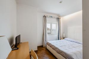 Katil atau katil-katil dalam bilik di Bi Hotel