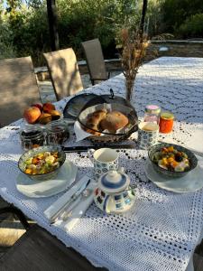 a table with plates of food on top of it at Villa Wishflower in Lefokastro