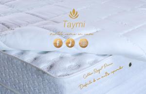 a close up of a mattress with the words tamil mercy mercy care on it at hotel taymi in Trujillo