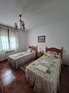 Postel nebo postele na pokoji v ubytování Viviendas Vacacionales Beni II