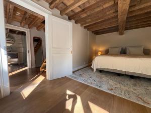 a bedroom with a bed and an open door at Maison Martin 7 in Kortrijk