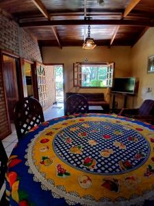 a room with a large table with a pattern on it at Cabañas Costa Santino in Ituzaingó