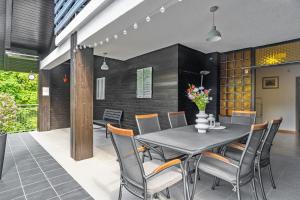 a dining room with a table and chairs at Resort pod orehi - Bled - Apartma & Glamping & Savna in Bled +20 photos