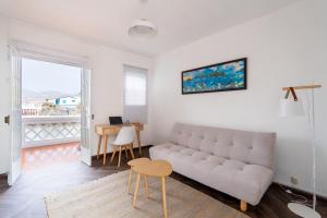 a living room with a couch and a table at Casa Nutria - Pucusana Las Ninfas - Beach and Sea in Pucusana