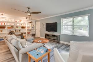 a living room with a couch and a fireplace at Swim, Golf and Relax! Kokomo on the Emerald Coast in Pensacola