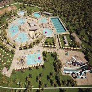 an aerial view of a resort with swimming pools at natoli in Căbeşti