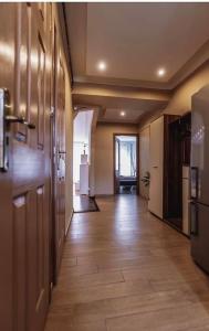 an empty hallway of an office building with a kitchen at City Center in Szeged