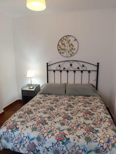 A bed or beds in a room at Apartamentos Guadalupe
