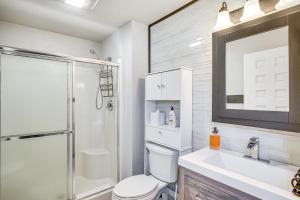 a bathroom with a toilet and a sink and a shower at 9 Mi to Shore Home with Hot Tub in Howards Grove! in Howards Grove +16 photos