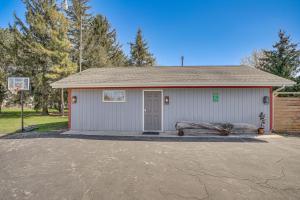 a building with a basketball hoop in front of it at 9 Mi to Shore Home with Hot Tub in Howards Grove! in Howards Grove