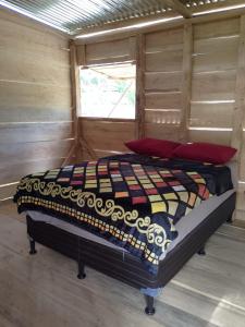 Postel nebo postele na pokoji v ubytování Cabin in the Mayan Jungle