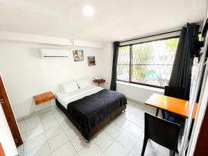 Postel nebo postele na pokoji v ubytování Hotel CasaBlanca Cartagena