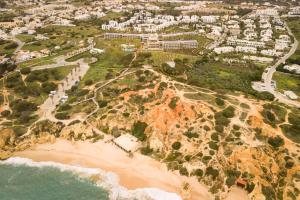 an aerial view of a beach and the ocean at Kimpton Atlantico Algarve by IHG in Albufeira