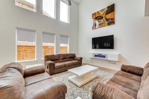 a living room with two couches and a tv at 8 Mi to Celebration Station Family Getaway! in Mesquite