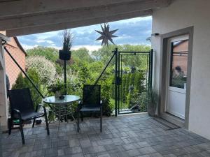 a patio with a table and chairs and a star at Inkognito in Teplice