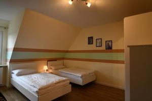 Postel nebo postele na pokoji v ubytování Haus Prause Wohnung 3 + 7 fotografií