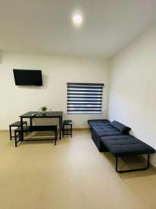 a living room with a couch and a table at Casa Rayón 2 in Tuxpan