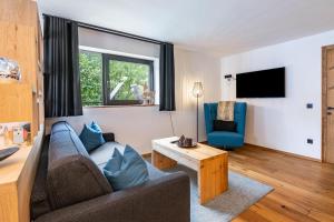 TV a/nebo společenská místnost v ubytování Chalet Ortles Apt ll