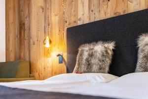 Ένα ή περισσότερα κρεβάτια σε δωμάτιο στο Chalet Ortles Apt ll