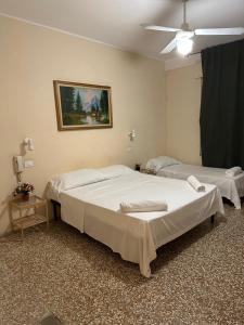 Postel nebo postele na pokoji v ubytování Pensione Trento
