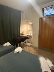 Postel nebo postele na pokoji v ubytování Pensione Trento