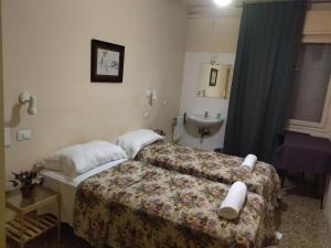 Postel nebo postele na pokoji v ubytování Pensione Trento