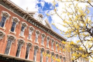 a large red brick building with a tower at Historic Plaza Hotel in Las Vegas