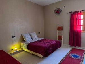 Postel nebo postele na pokoji v ubytování Riad Tazoulte