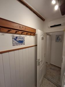 a room with white cabinets and an open door at 1918Apartman Šibenik centar,Poljana in Šibenik