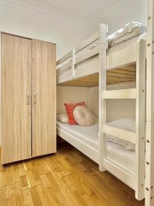 a room with two bunk beds and a cabinet at Budget 29 in London