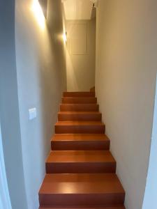 a stairway with wooden steps in a house at Donna Caterina in Monopoli