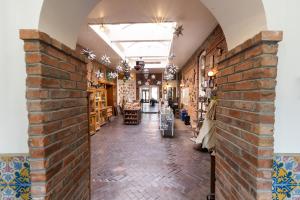 a room with a brick wall next to a store at Historic Plaza Hotel in Las Vegas +33 photos