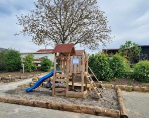 a playground with a slide and a slideintend at Auszeit und Idylle auf dem Pferdehof in Kirchberg an der Murr
