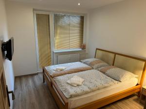 a bedroom with a bed with two pillows on it at Bulharská Trojizbový apartmán in Košice